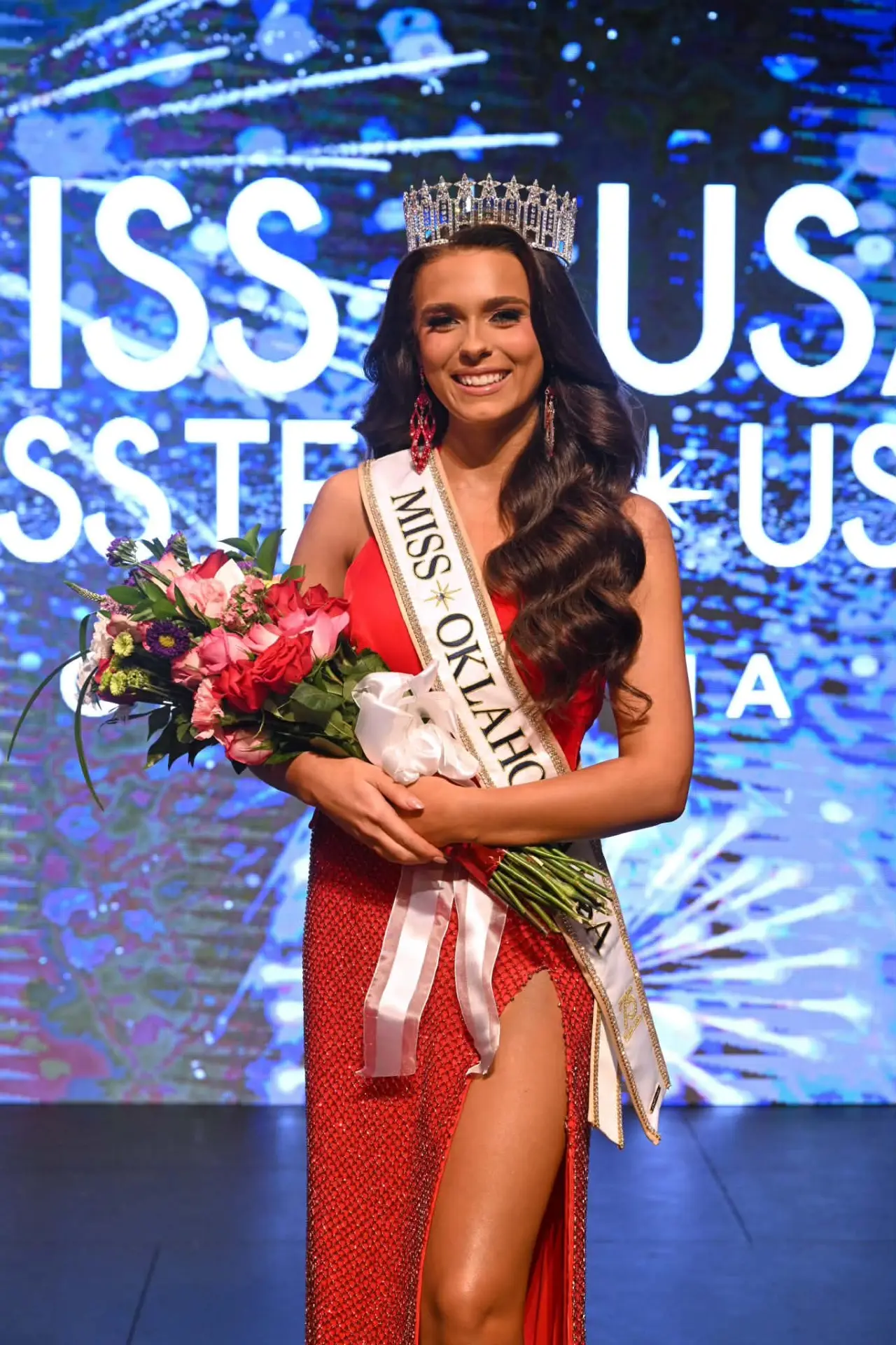 Miss Oklahoma USA 2026 crowned on stage with sash and bouquet